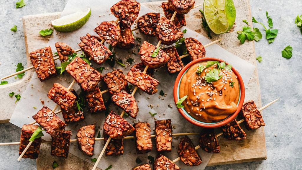 skewers with sesame and a bowl with sauce